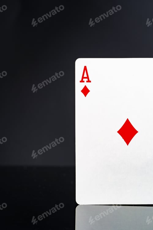 Preview: Playing cards on black background studio shot