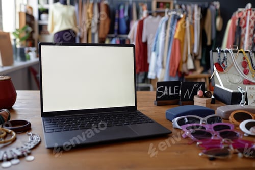 Preview: Computer with White Mockup Screen on Table at Thrift Store