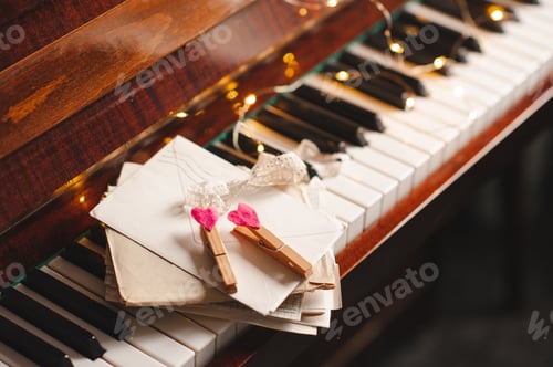 Preview: Piano keys with paper mail post