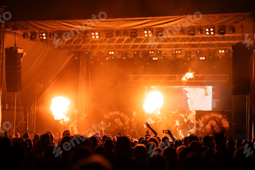 Preview: Crowd at concert and blurred stage lights.
