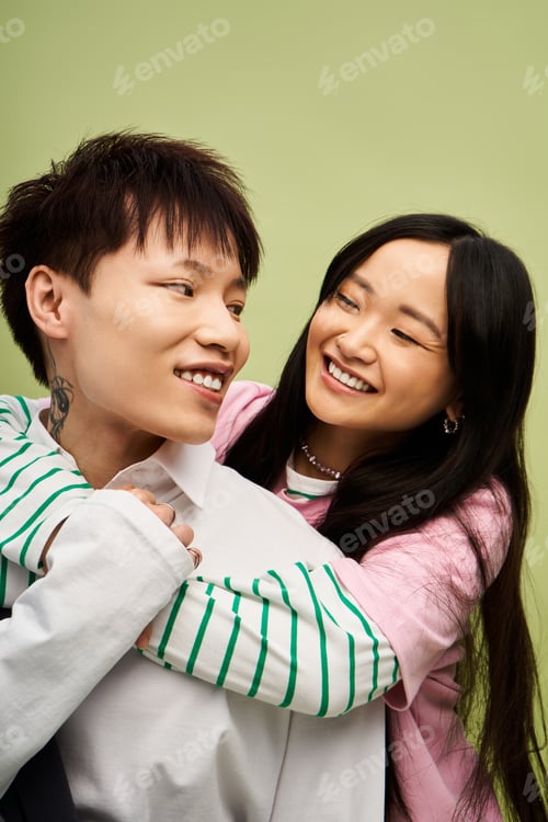 Preview: Couple enjoying a joyful moment together, showcasing their stylish outfits and love for each other