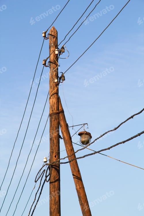 Preview: Old lamp post on a background of blue sky