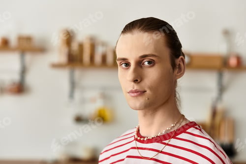 Preview: Young handsome man with a fashionable look in a cozy interior setting