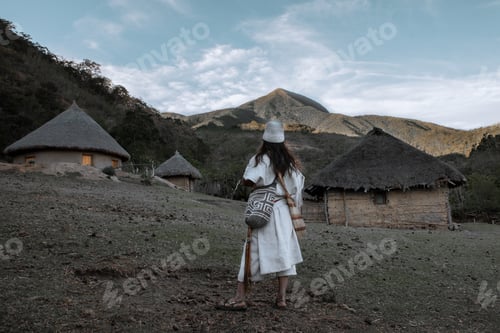 Preview: An Arhuaco indigenous man observes the mountain from a local settlement.