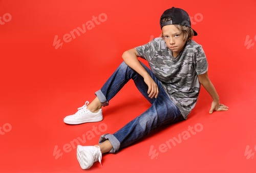 Preview: Child Model Poses on a Red Background
