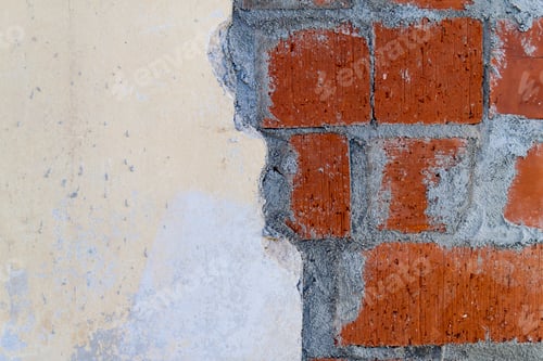 Preview: Close up of bricklaying industrial installing bricks on construction site wall