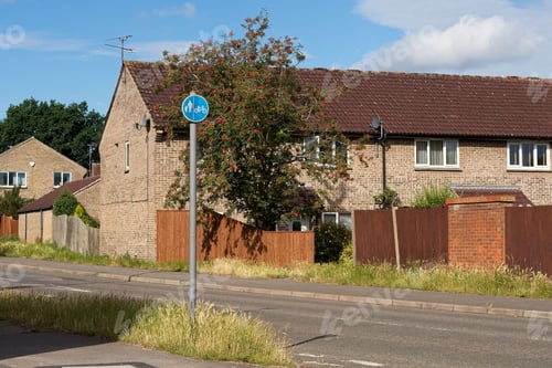 Preview: Pedestrian and biking sign near brick houses in West Berkshire