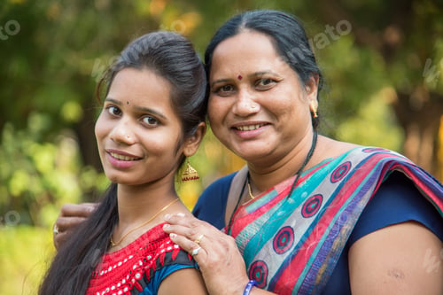 Preview: Portrait of happy mother and daughter embracing.