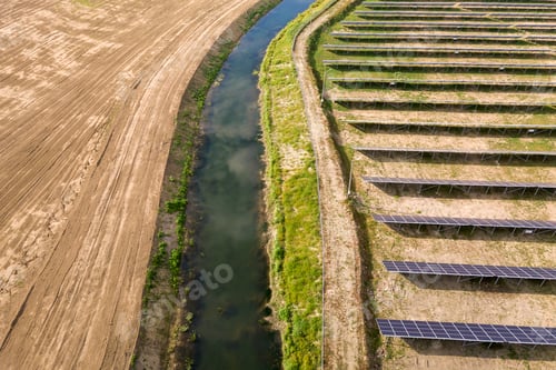 Preview: Aerial view of solar power plant. Electric panels for producing clean ecologic energy.