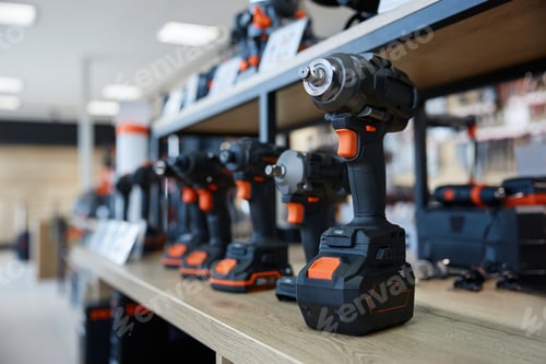 Preview: A black and orange drill is on display on a store shelf