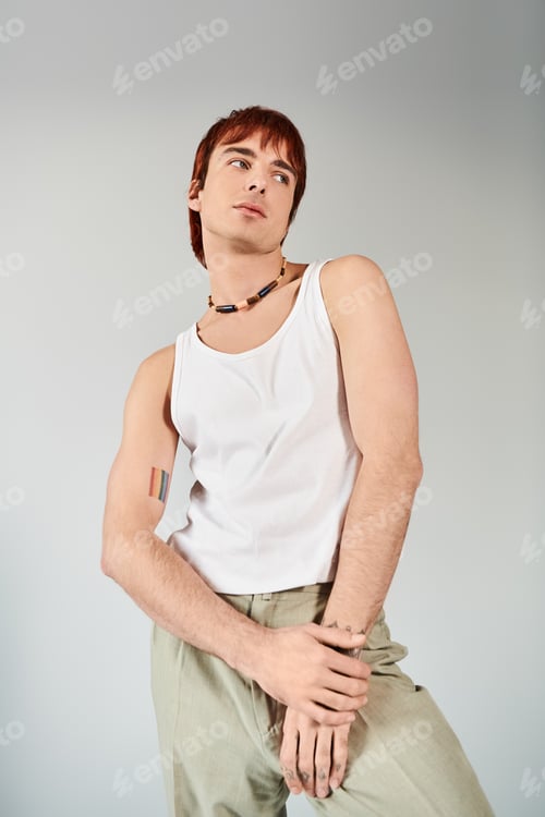 Preview: Modern pose: stylish man in white tank top and khaki pants