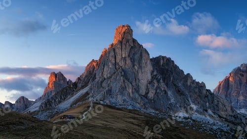 Preview: Giau Pass, Dolomite Alps, Italy. View of the mountains and high cliffs during sunset.