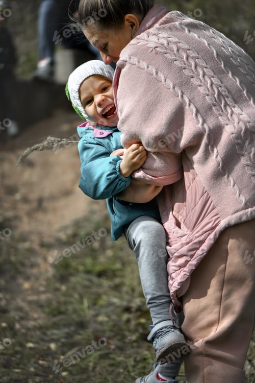 Preview: Mom and daughter are walking in the park