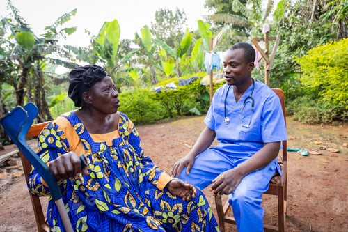Preview: A young African doctor pay a visit to an old ill woman. Home visit to a sick elder