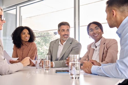 Preview: Happy busy diverse executive board business team at office meeting table.