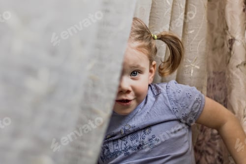 Preview: Little girl hiding behind the curtains