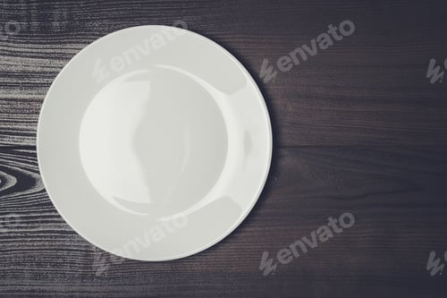 Preview: white plate on the wooden brown table