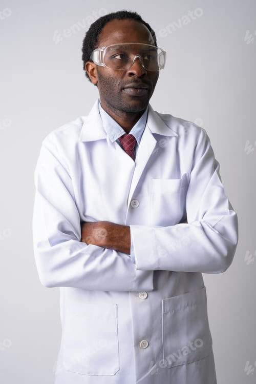 Preview: African man doctor with protective glasses thinking