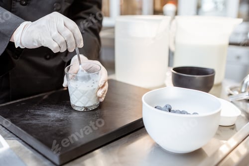 Preview: Chef mixing milk with lavender and blueberries, making ice cream