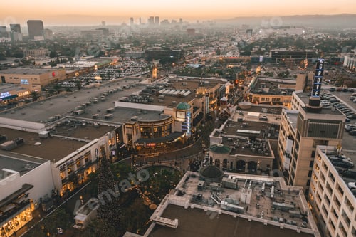 Preview: The Grove Shopping Center in Los Angeles at Sunset with Shops and Hollywood Skyline in the distance