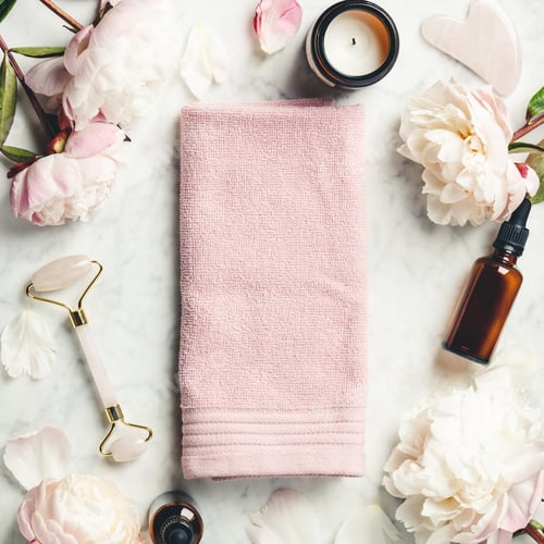 Relaxing Spa Day with Flowers and Pink Towel