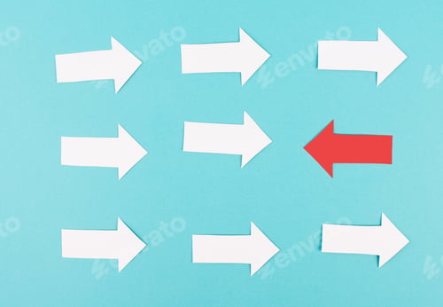 Preview: White arrows on a blue background, one red is standing out, do different, be a winner, individuality