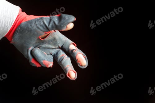 Preview: A damaged glove is depicted in the image, showcasing its worn, dirty, and leaky condition. The defoc