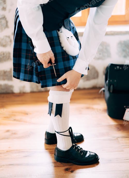 Preview: Man in Kilt and White Socks Preparing