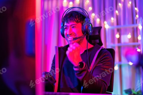 Preview: At home game player wearing headset have fun play battle streaming online game