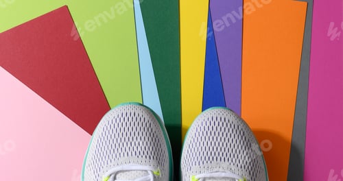 Preview: White women's sneakers with laces on a color background, top view
