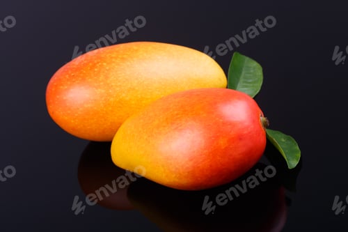 Preview: Ripe Mango on black background