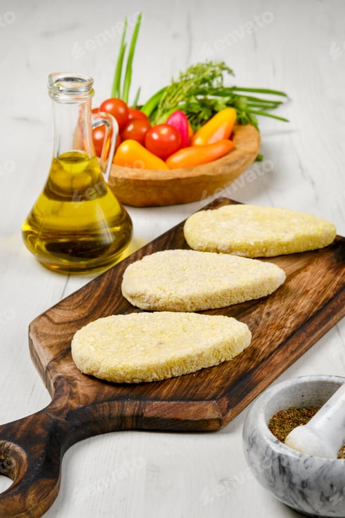 Preview: Semifinished homemade zander cutlet on a wooden board