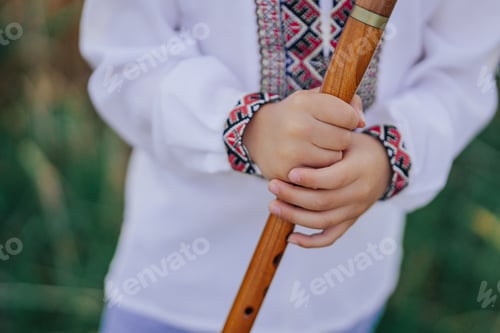 Preview: Hands Of Little Boy Kid Playing On Woodwind Wooden Flute - Ukrainian Sopilka