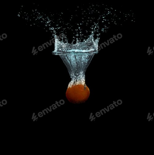 Preview: Tangerine falling down into clear water against black background