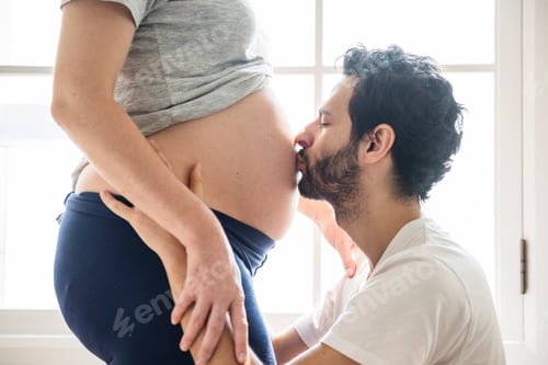 Preview: Husband kissing baby bump