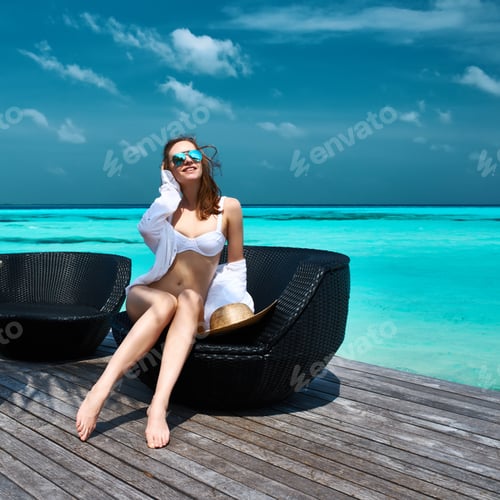 Preview: Woman On A Tropical Beach Jetty At Maldives