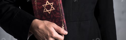 Preview: panoramic shot of young jewish man holding tanakh