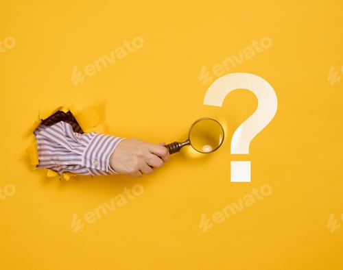 Preview: Female hand holds a magnifying glass on a yellow background, part of the body sticks out