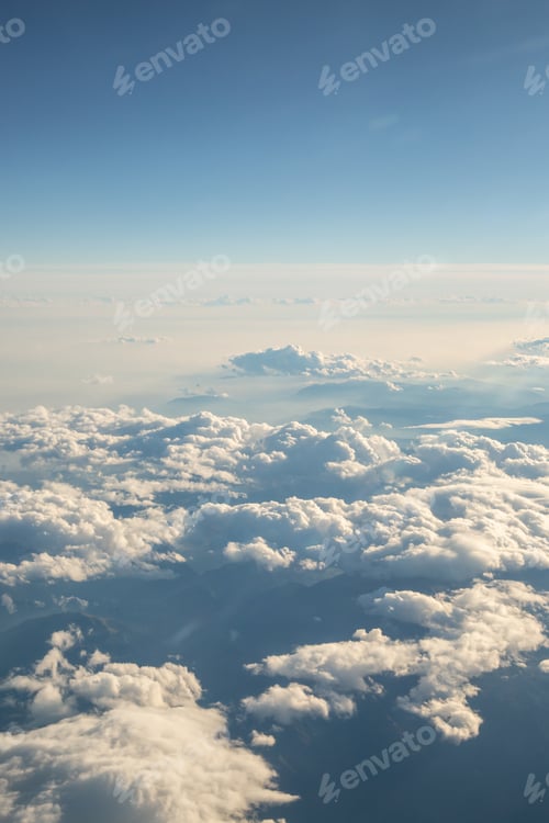 Preview: Fluffy white clouds, a view from airplane window