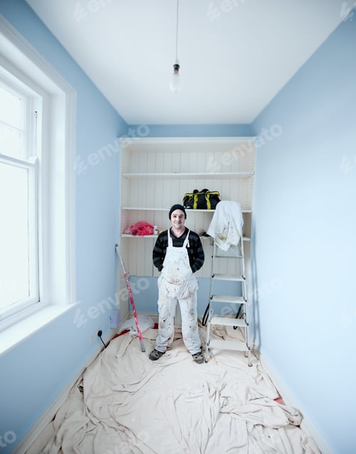 Preview: Painter and decorator wearing overalls