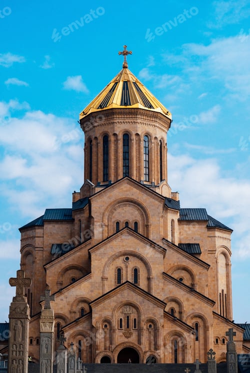 Preview: Tsminda Sameba - Holy Trinity Church in Tbilisi, Georgia on a sunny day against a blue sky.