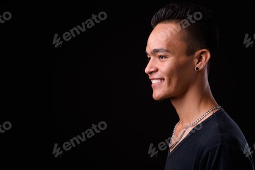 Preview: Closeup profile view of young handsome Indian man