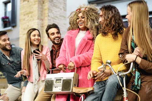 Preview: Young multiracial friends having fun listening music with vintage boombox stereo