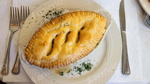 Preview: Food from above with chicken pot pie with delicious crust on top.