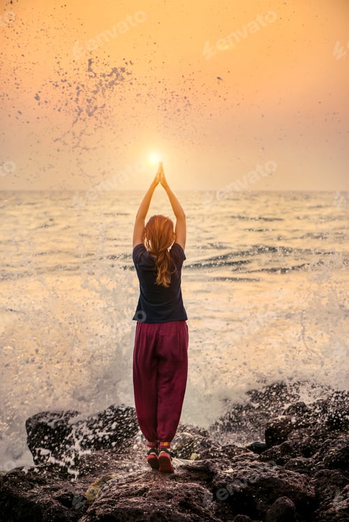Preview: Beautiful yoga meditation reflection on water Goa beach on sunse