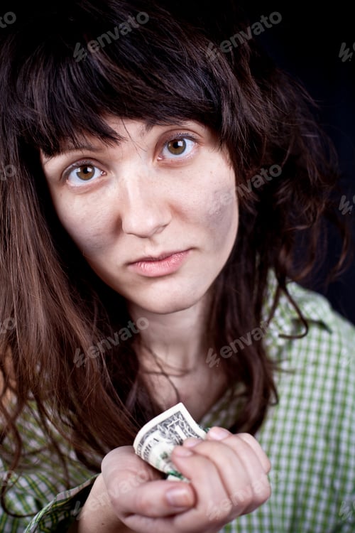 Preview: Begging young woman with some money iin her hands.