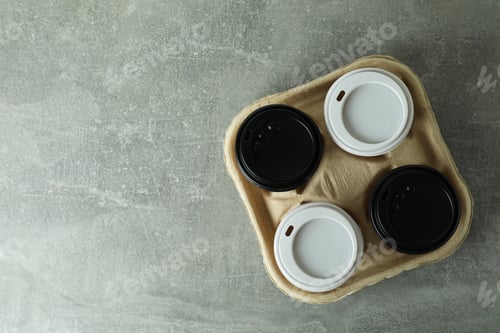 Preview: Cup holder with coffee cups on gray textured background