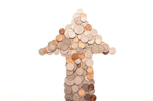 Preview: Coins in the shape of an upward arrow, the direction of growth of business and finance, money