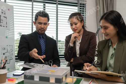 Preview: Architects work with engineers and contractors in the office to check the accuracy of the first draf