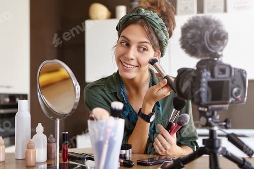 Preview: Indoor shot of young beuatiful female making beauty vlog episode about high quality cosmetics for wo